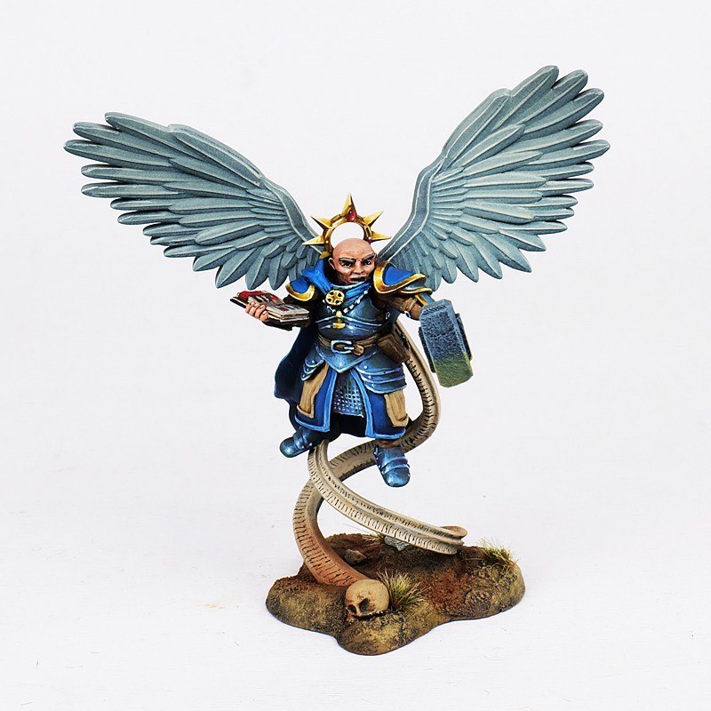 Painted angel miniature with broad wings and blue armor
