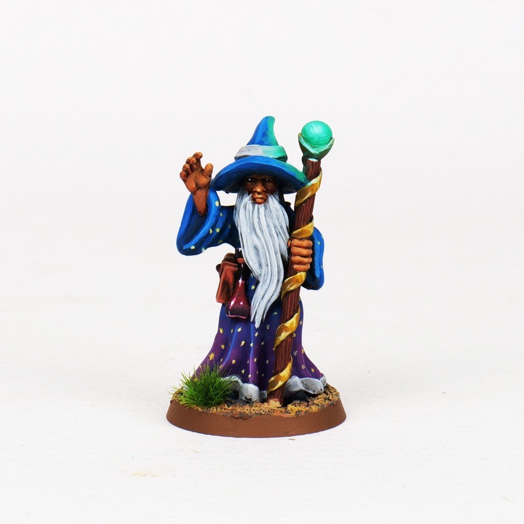Painted wizard miniature with blue robes and staff